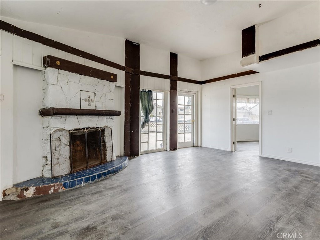 396 Pier Avenue Oceano, CA 93445 - Photo 9 of 24 a view of an empty room with a fireplace and a window