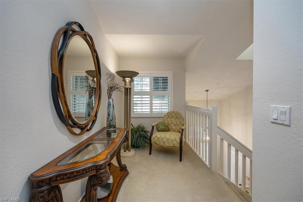 203 Via Perignon, Unit 24 Naples, FL 34119 - Photo 12 of 42 Quiet sitting lounge area top of stairs