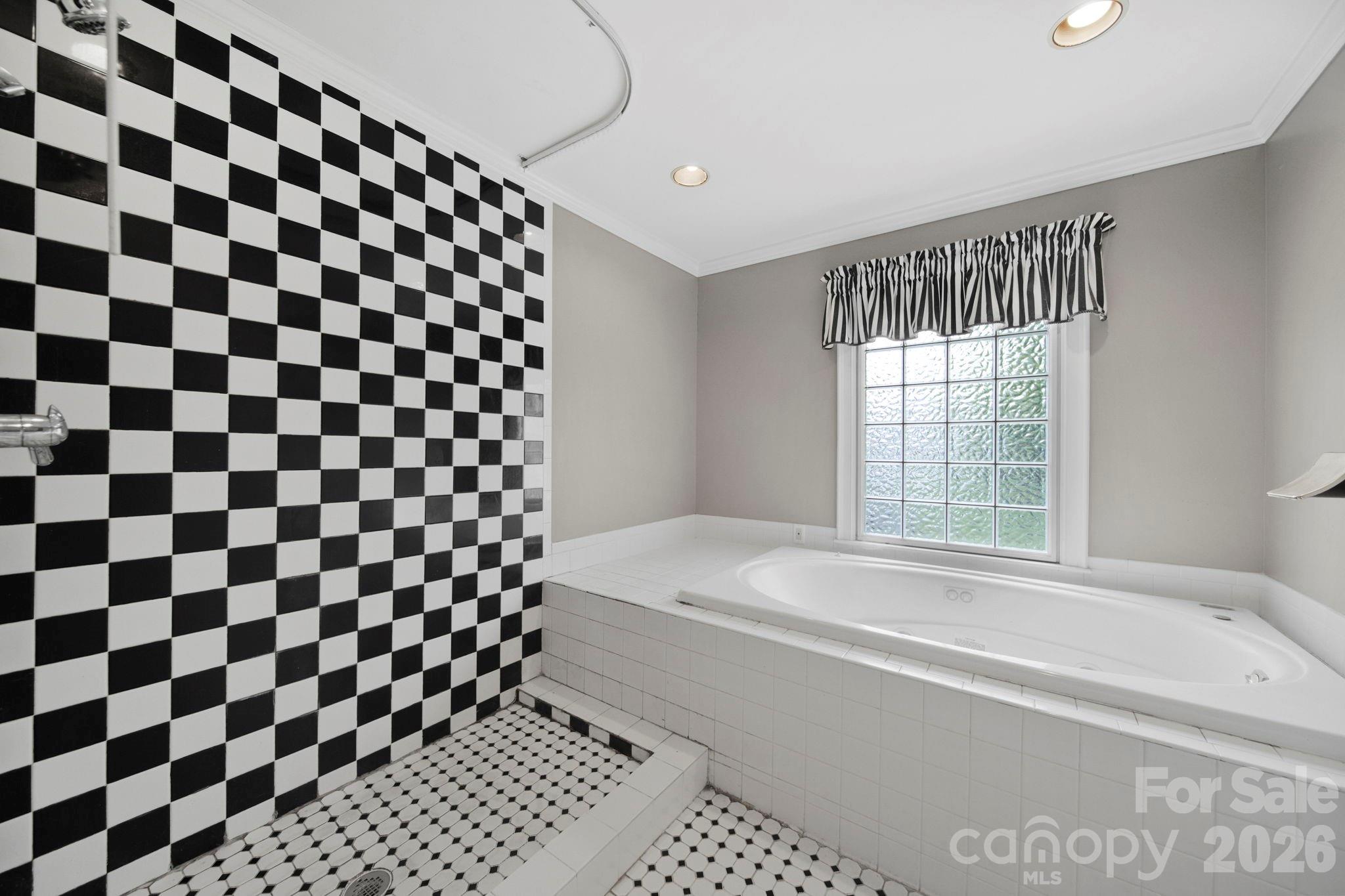 1109 Union Road Gastonia, NC 28054 - Photo 34 of 44 a bathroom with a bathtub and a shower