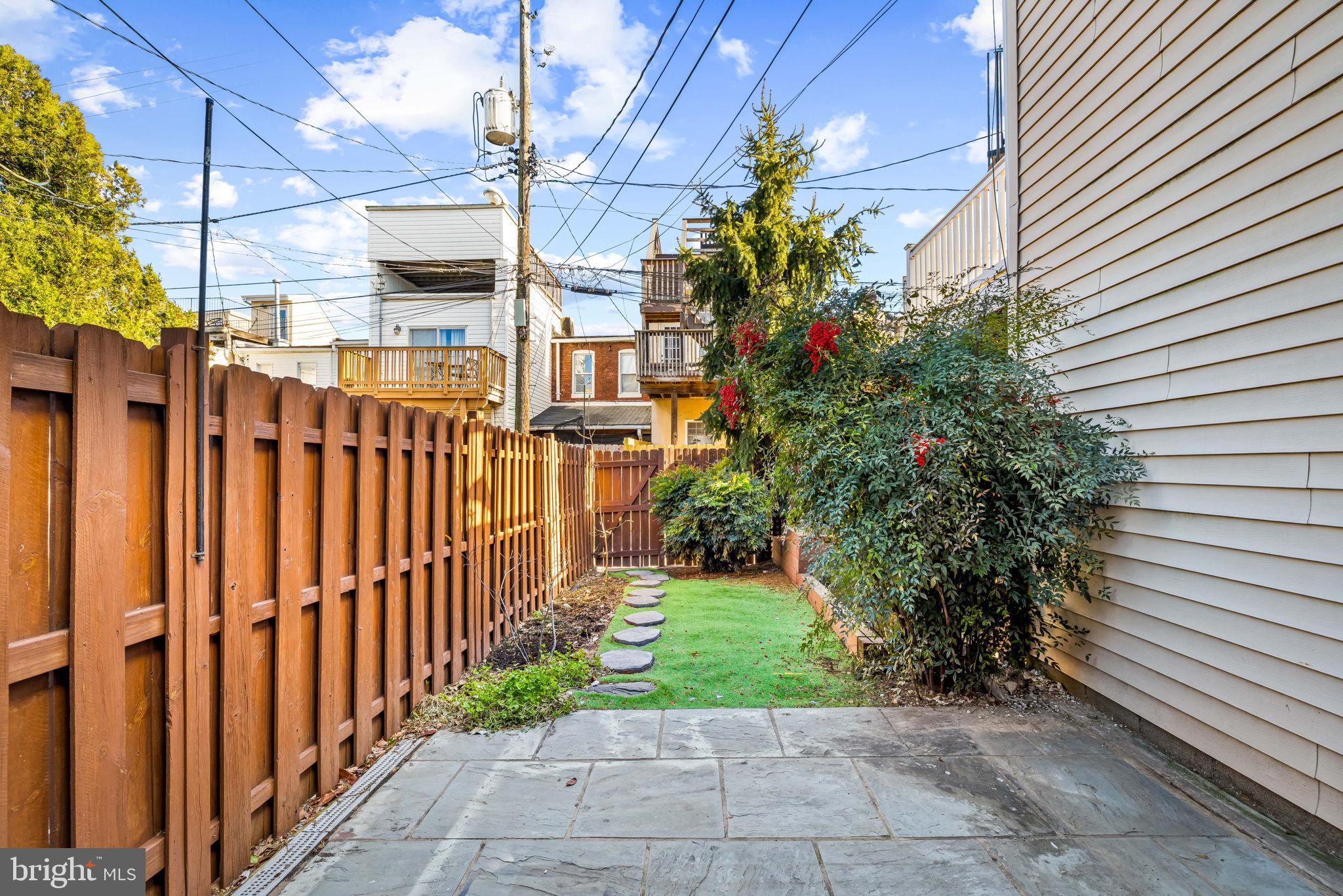 1459 Woodall Street Baltimore, MD 21230 - Photo 32 of 34 a view of a pathway with a house