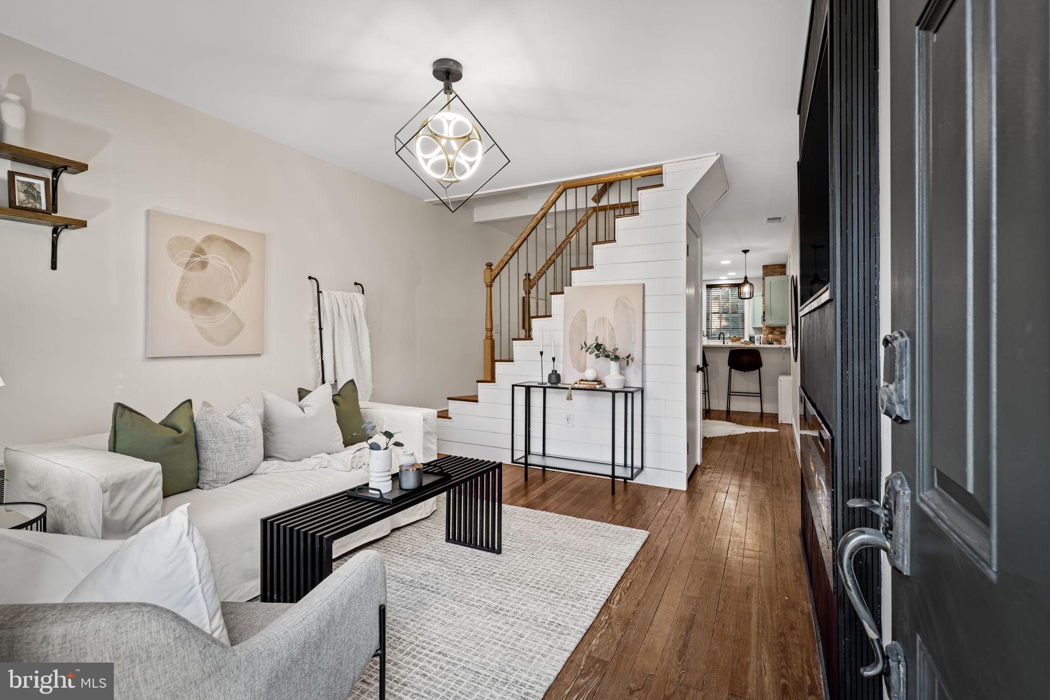 1459 Woodall Street Baltimore, MD 21230 - Photo 7 of 34 a living room with furniture and a table