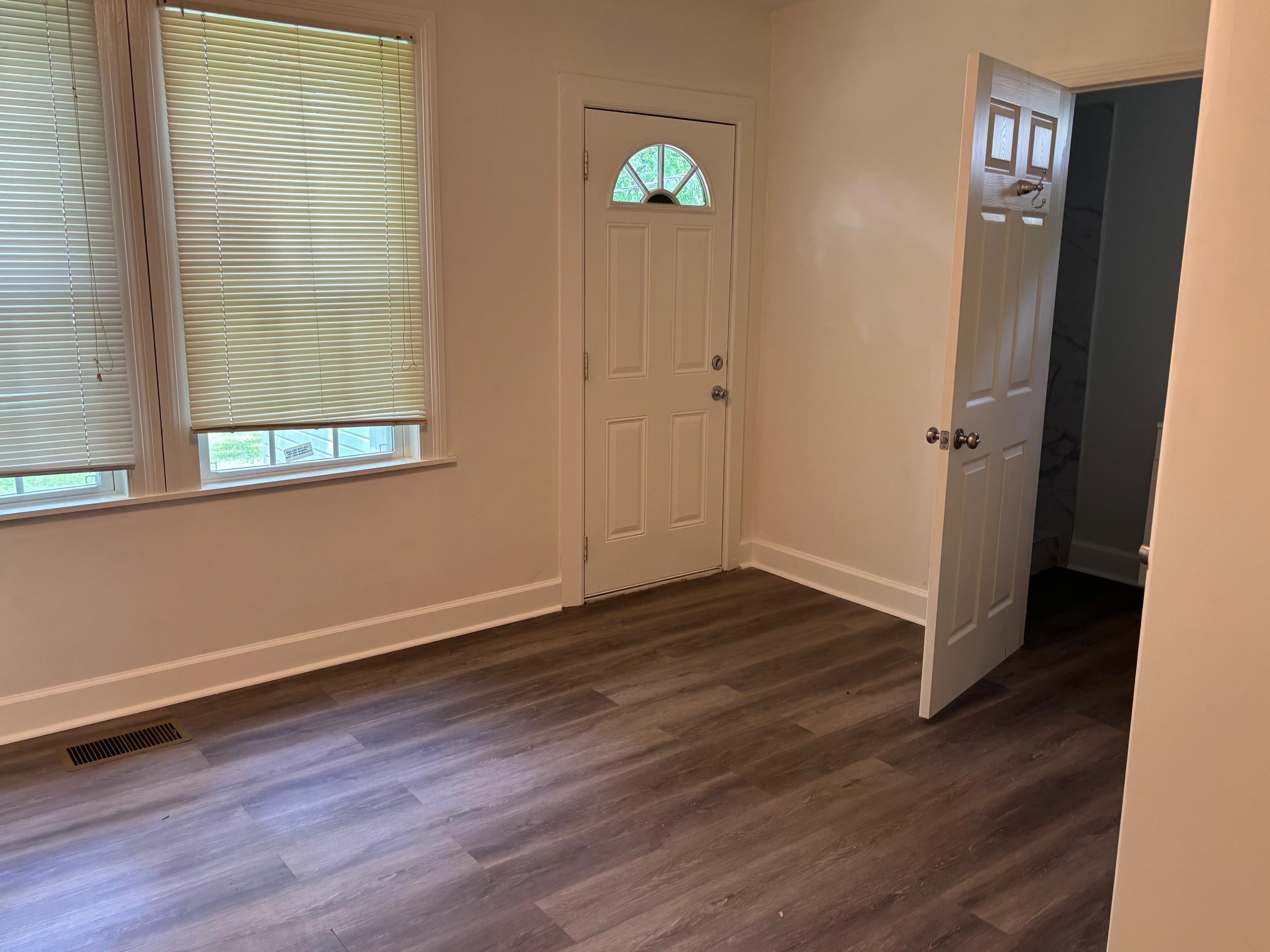 3750 Kearney Avenue Memphis, TN 38111 - Photo 13 of 14 an empty room with wooden floor and windows