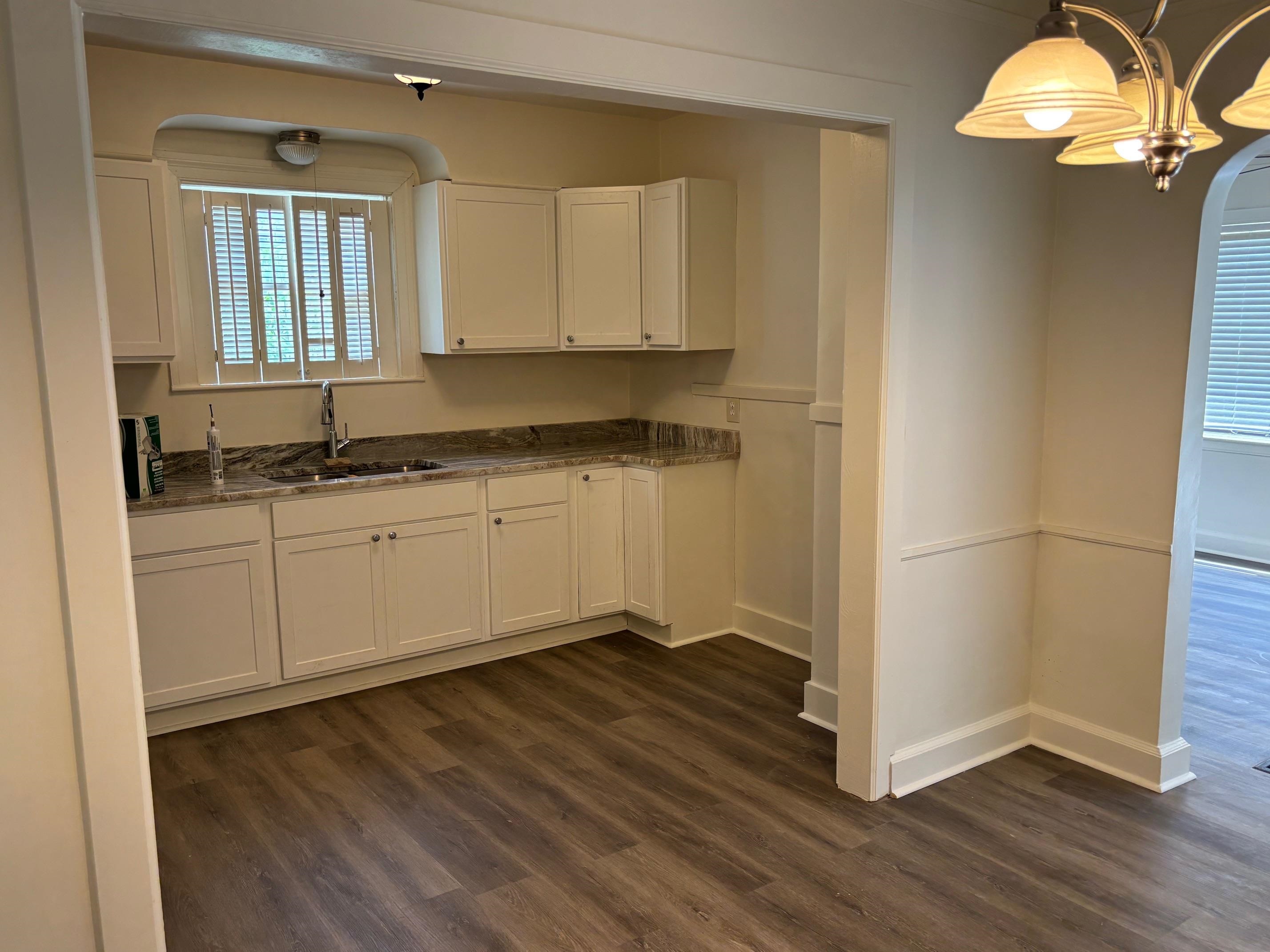 3750 Kearney Avenue Memphis, TN 38111 - Photo 10 of 14 a kitchen with a sink cabinets and wooden floor