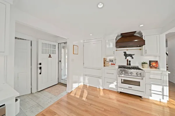 a kitchen with cabinets a sink and appliances