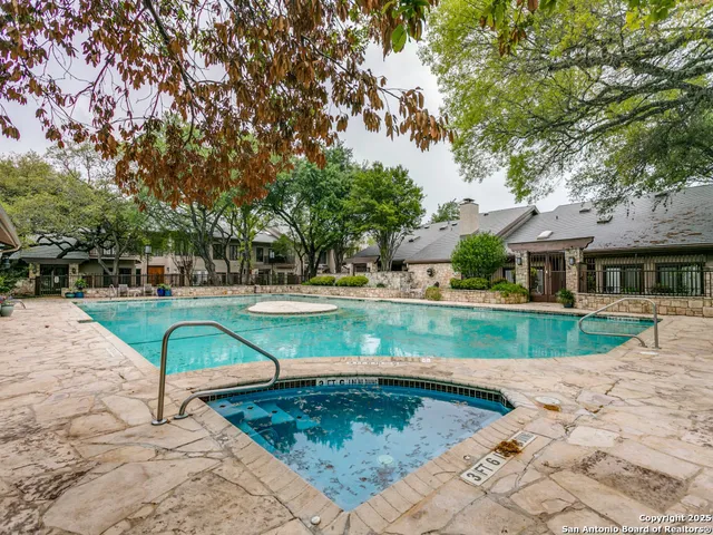 a view of a house with swimming pool
