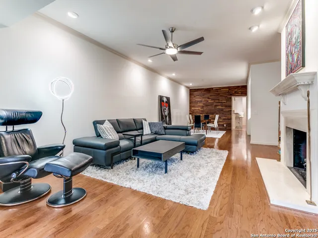 a living room with furniture a rug and a fireplace