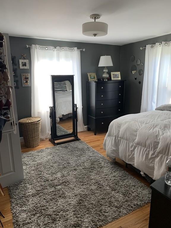 17 Daley Street Leominster, MA 01453 - Photo 17 of 21 a bedroom with a bed and a chandelier