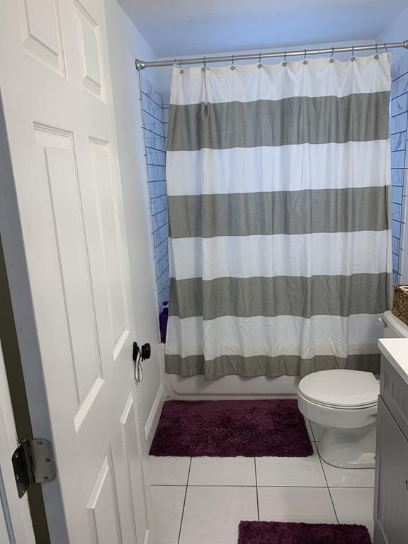 17 Daley Street Leominster, MA 01453 - Photo 20 of 21 a bathroom with a sink a toilet a shower curtain