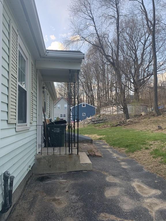 17 Daley Street Leominster, MA 01453 - Photo 4 of 21 a view of a house with backyard and a sitting area