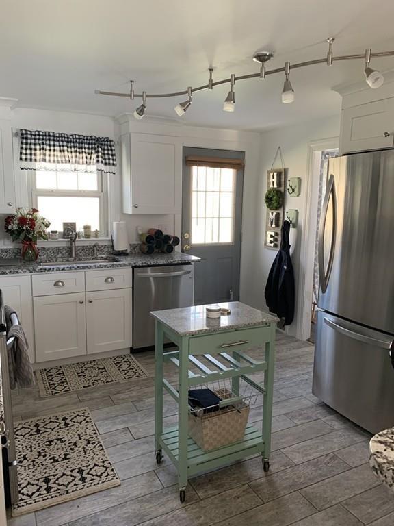 17 Daley Street Leominster, MA 01453 - Photo 7 of 21 a kitchen with a sink appliances and cabinets