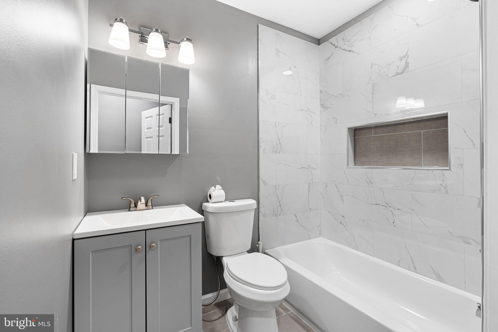 2550 North 12th Street Philadelphia, PA 19133 - Photo 5 of 8 a bathroom with a sink a toilet and shower