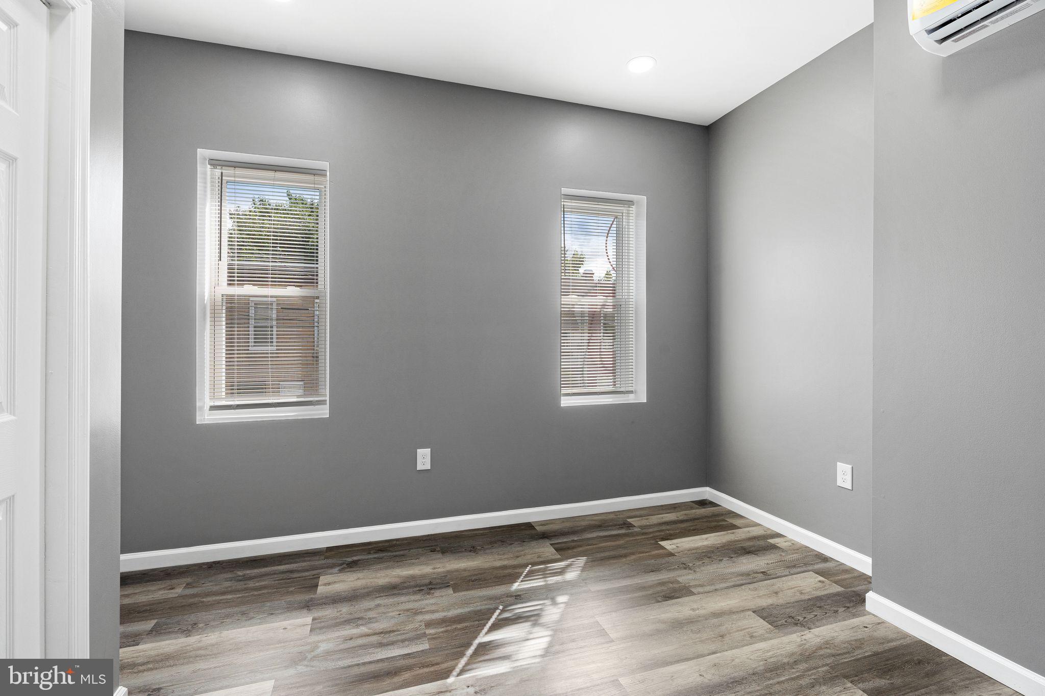 2550 North 12th Street Philadelphia, PA 19133 - Photo 6 of 8 a view of empty room with wooden floor and fan