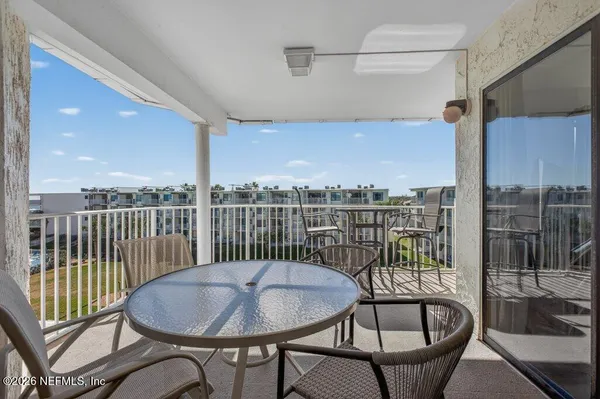 a view of a balcony dining area