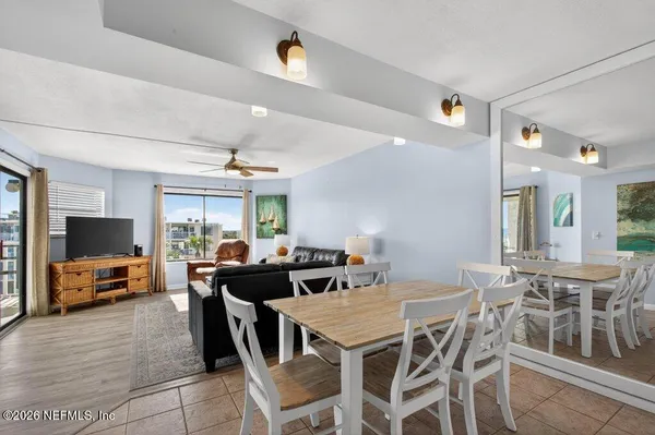 a view of a dining room with furniture window and wooden floor