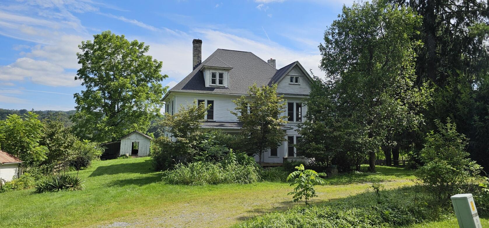 2900 Floyd Highway North Floyd, VA 24091 - Photo 7 of 50 a front view of a house with a yard and trees
