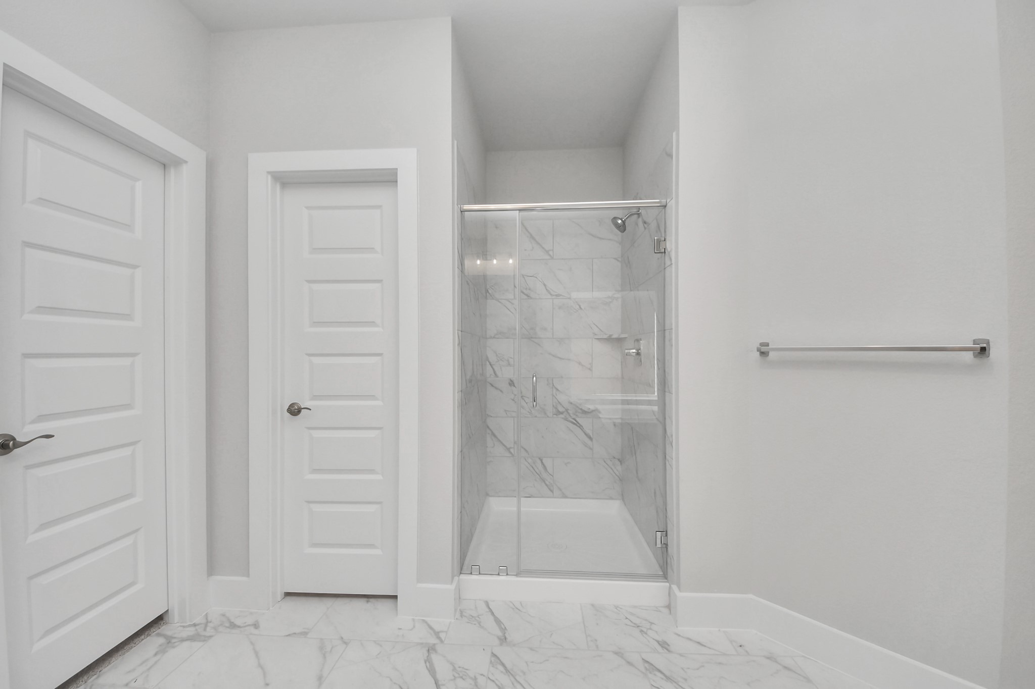 3110 Native Spg Drive Spring, TX 77373 - Photo 20 of 34 Indulge in a spa-like retreat within the confines of this primary bathroom. Delight in a spacious walk-in shower enveloped in stylish tile surround, unwind in a separate garden tub adorned with custom detailing. Sample photo of completed home with similar floor plan. Actual colors and selections may vary.