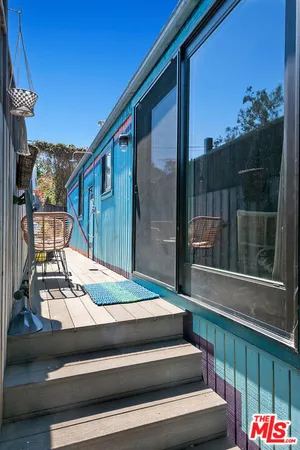 a kitchen with stainless steel appliances granite countertop a refrigerator and a stove