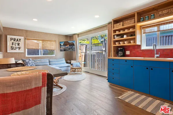 a room with furniture and flowerpot
