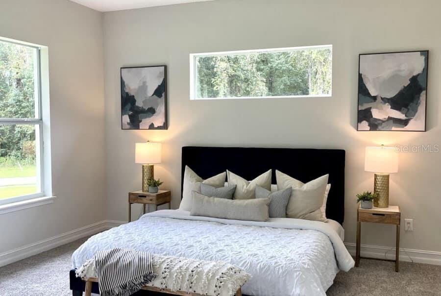 1955 Northwest 79th Loop Ocala, FL 34475 - Photo 6 of 8 a bedroom with a bed and window