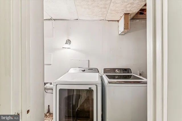 a utility room with dryer and washer