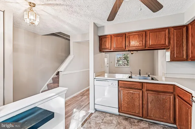 a kitchen with a sink cabinets and window