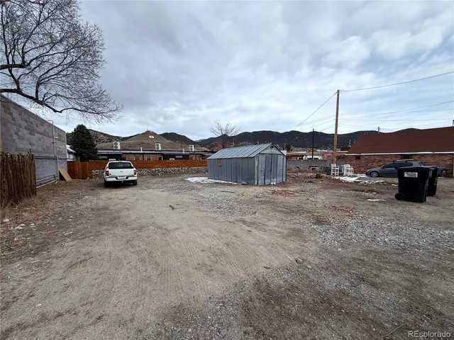 a view of street with parked cars