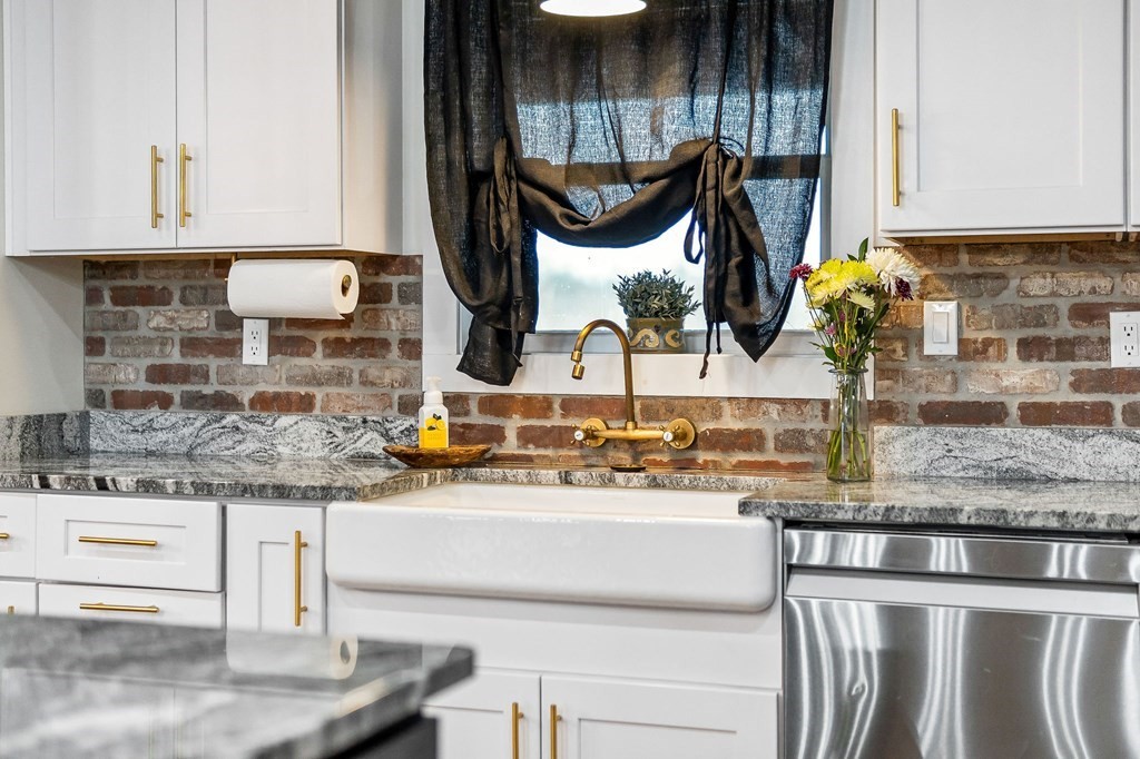 240 Bob Ledbetter Road Livingston, TN 38570 - Photo 19 of 62 a kitchen with kitchen island granite countertop a sink and a stove