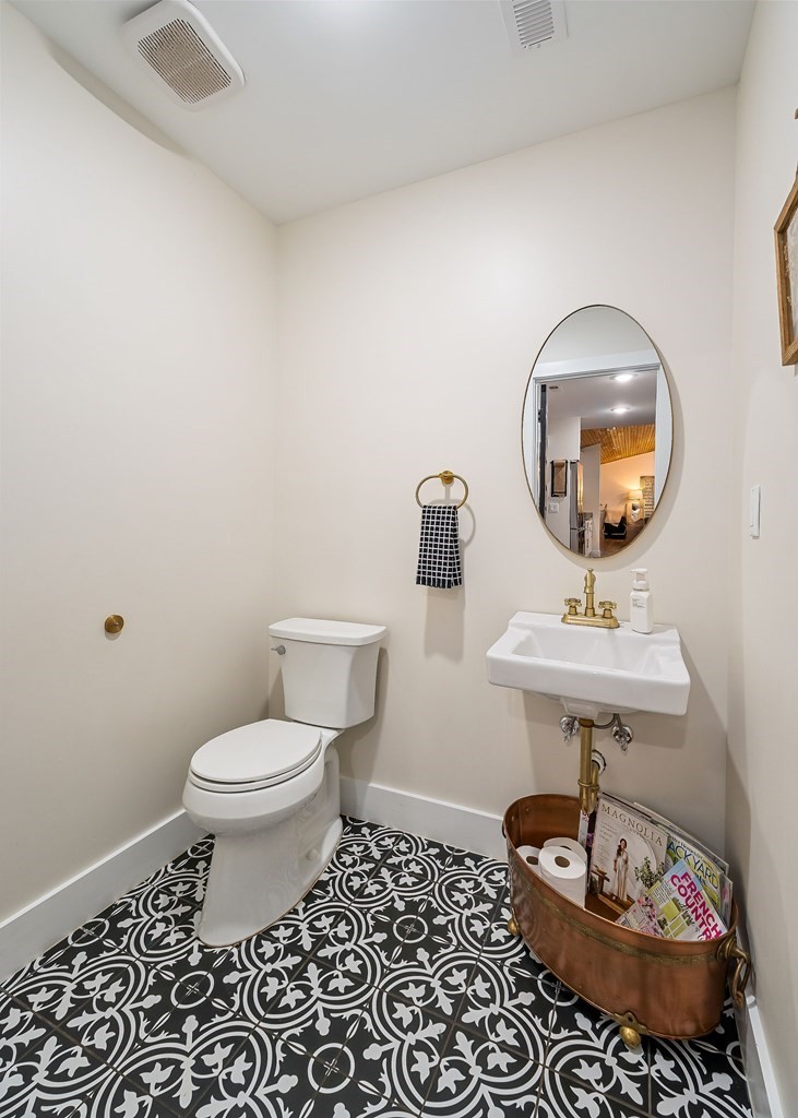 240 Bob Ledbetter Road Livingston, TN 38570 - Photo 20 of 62 a bathroom with a toilet a sink and a mirror