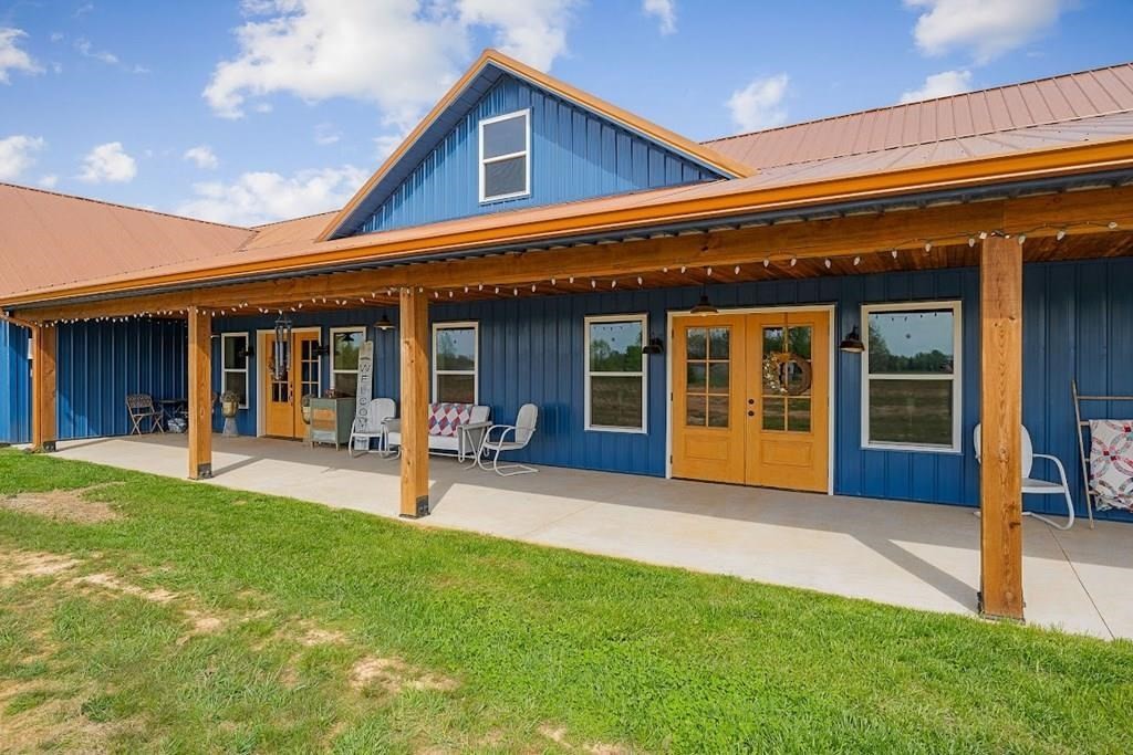 240 Bob Ledbetter Road Livingston, TN 38570 - Photo 2 of 62 a view of a house with sitting area and porch