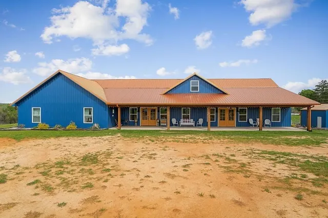 a view of a building with sitting area