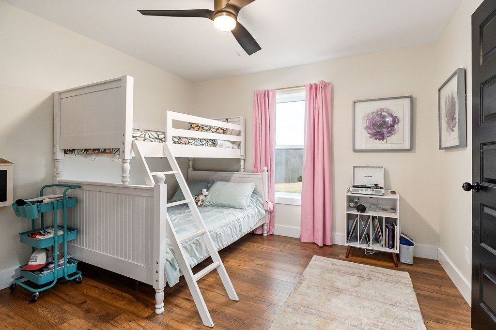 240 Bob Ledbetter Road Livingston, TN 38570 - Photo 34 of 62 a living room with furniture and a wooden floor