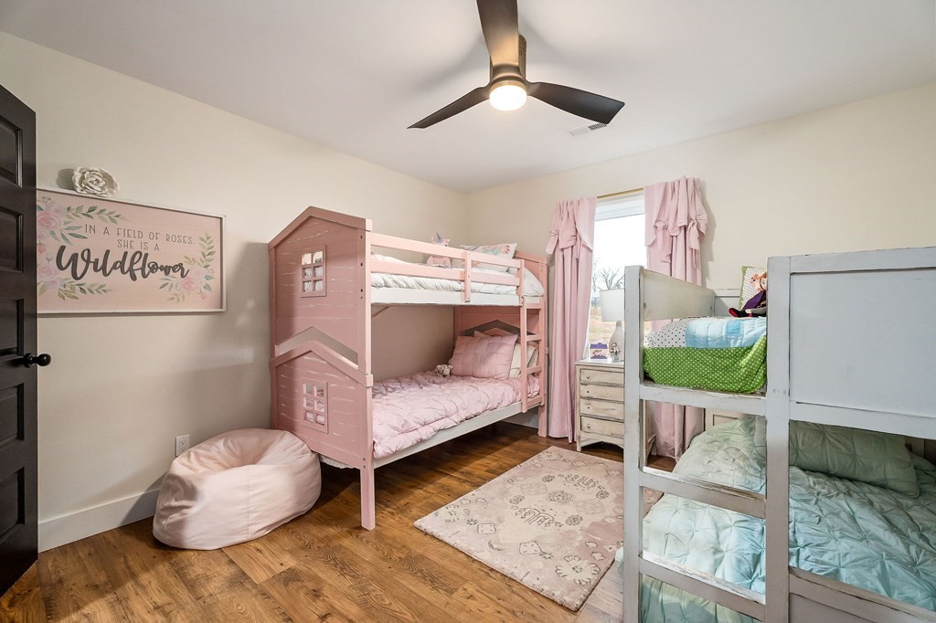 240 Bob Ledbetter Road Livingston, TN 38570 - Photo 40 of 62 a bedroom with furniture and a wooden floor
