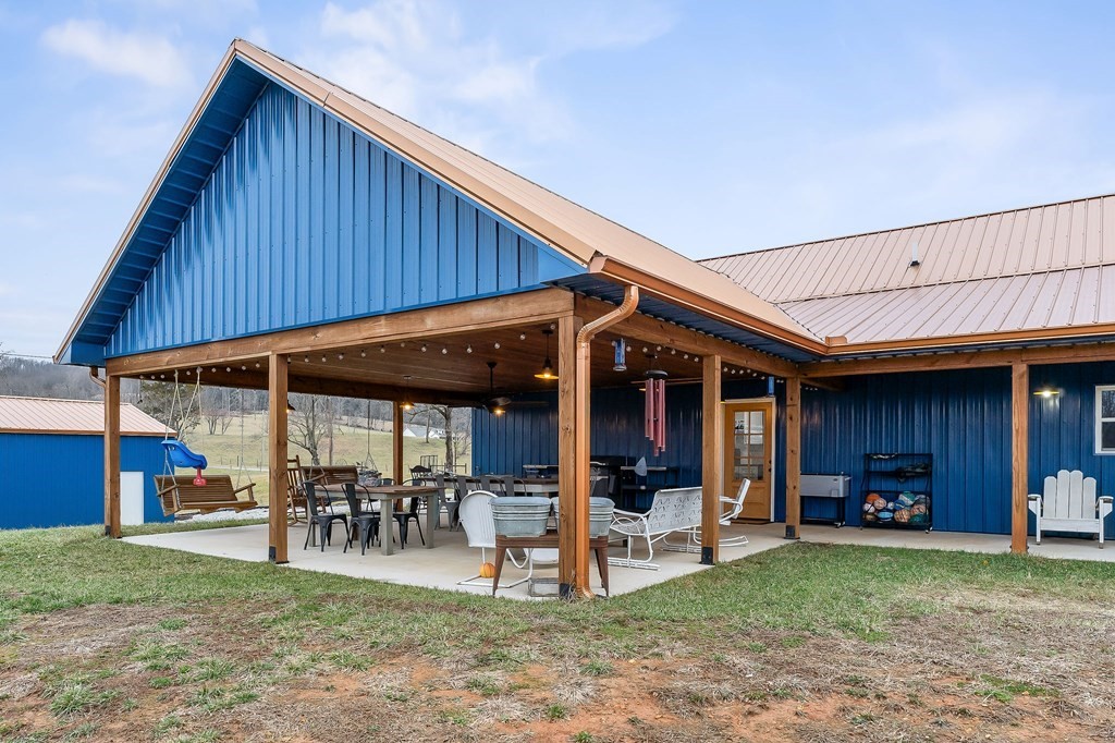 240 Bob Ledbetter Road Livingston, TN 38570 - Photo 48 of 62 a view of a backyard with table and chairs
