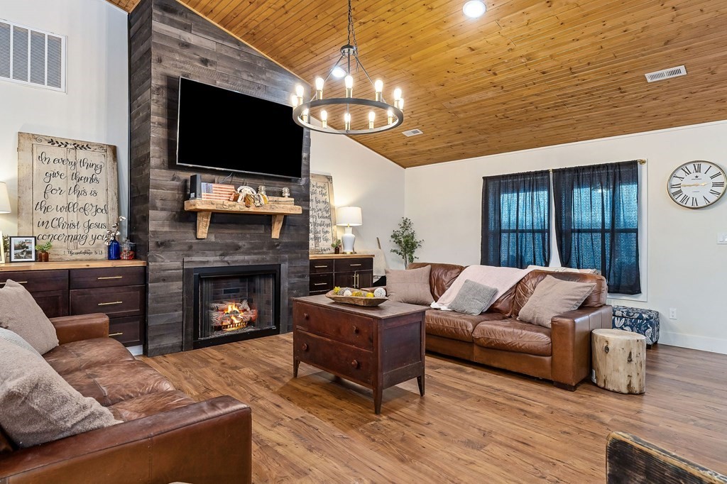240 Bob Ledbetter Road Livingston, TN 38570 - Photo 7 of 62 a living room with furniture a flat screen tv and a fireplace