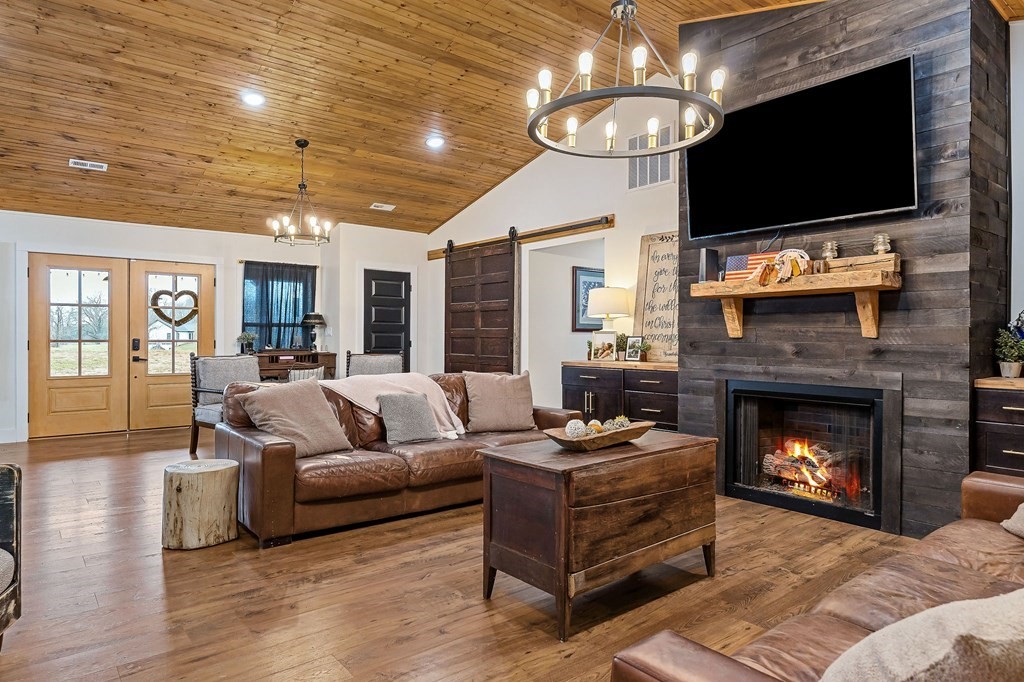 240 Bob Ledbetter Road Livingston, TN 38570 - Photo 9 of 62 a living room with furniture a flat screen tv and a fireplace