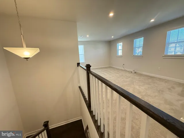 a view of a hallway with a window