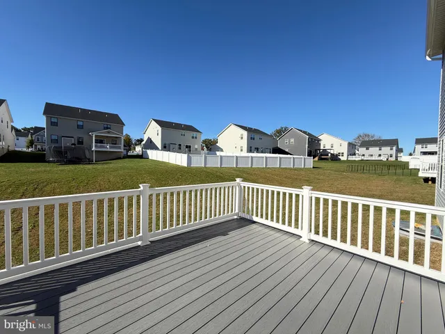 a view of a wooden deck and city view