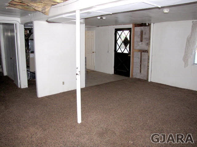 998 21 Road Grand Junction, CO 81505 - Photo 12 of 26 an empty room with closet and windows