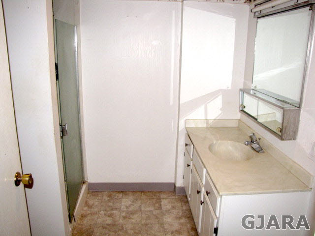 998 21 Road Grand Junction, CO 81505 - Photo 15 of 26 a bathroom with a sink and a mirror