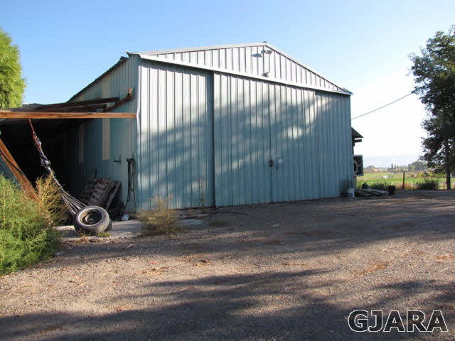998 21 Road Grand Junction, CO 81505 - Photo 23 of 26 a view of a backyard with a wooden fence