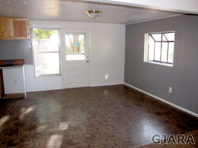 998 21 Road Grand Junction, CO 81505 - Photo 4 of 26 an empty room with windows