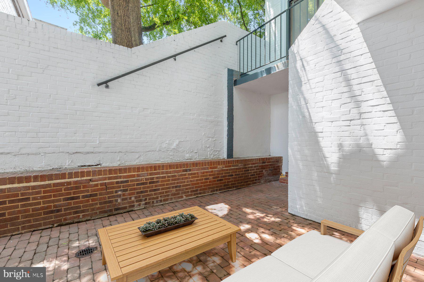 207 South Patrick Street, Unit 104 Alexandria, VA 22314 - Photo 14 of 33 a view of balcony with wooden floor