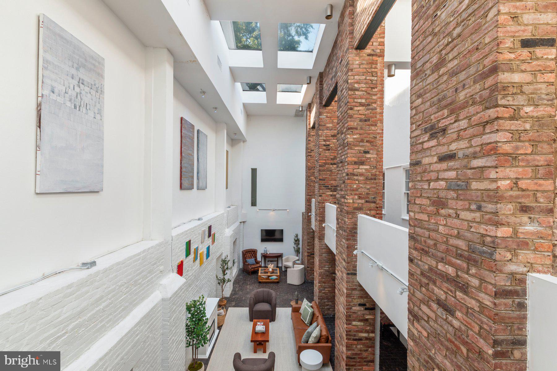 207 South Patrick Street, Unit 104 Alexandria, VA 22314 - Photo 19 of 33 a city view with tall buildings