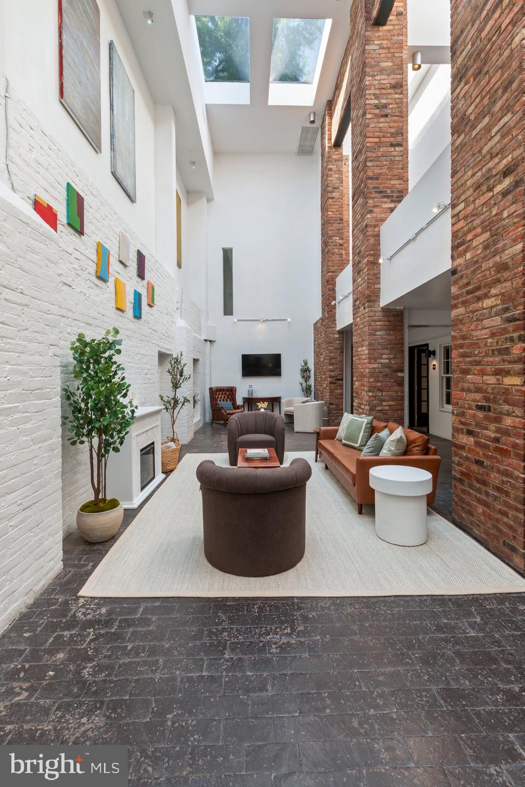 207 South Patrick Street, Unit 104 Alexandria, VA 22314 - Photo 21 of 33 a view of a patio with couches and potted plants