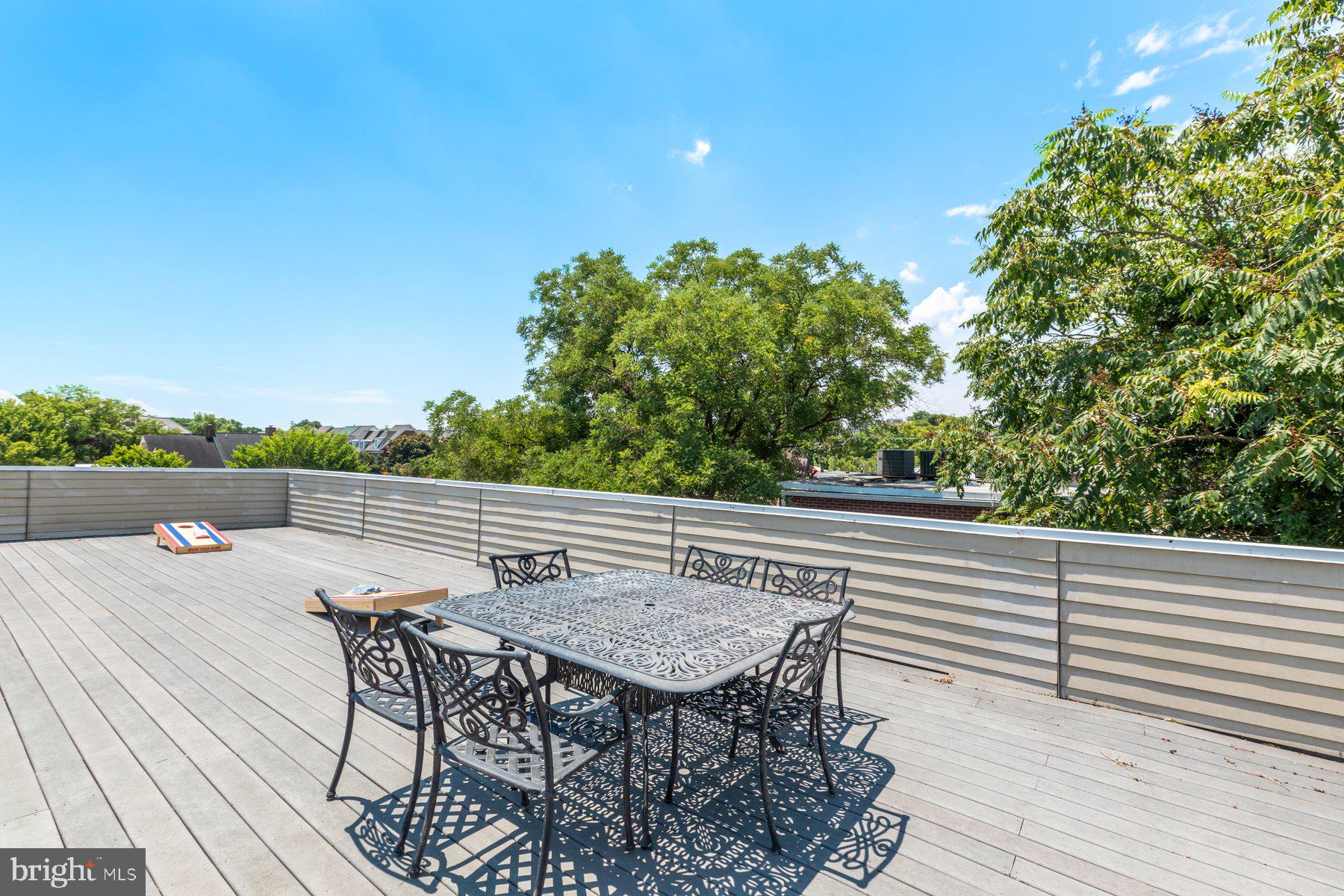 207 South Patrick Street, Unit 104 Alexandria, VA 22314 - Photo 24 of 33 a terrace with outdoor seating and trees