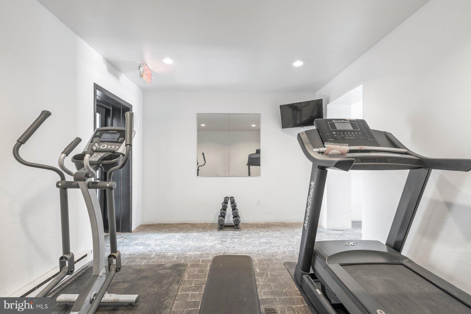 207 South Patrick Street, Unit 104 Alexandria, VA 22314 - Photo 26 of 33 a view of a room with gym equipment