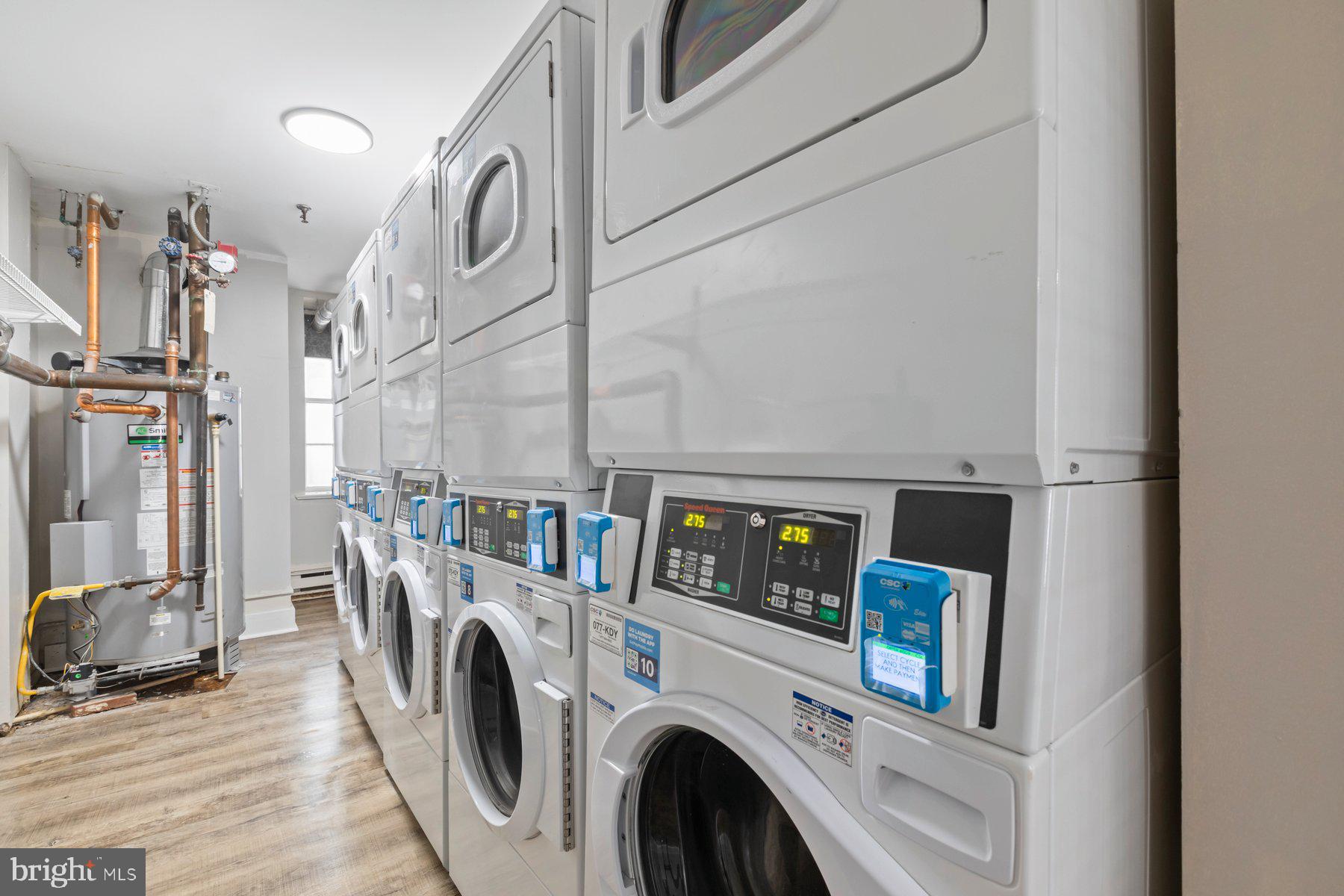 207 South Patrick Street, Unit 104 Alexandria, VA 22314 - Photo 27 of 33 a view of a storage & utility room with washer and dryer