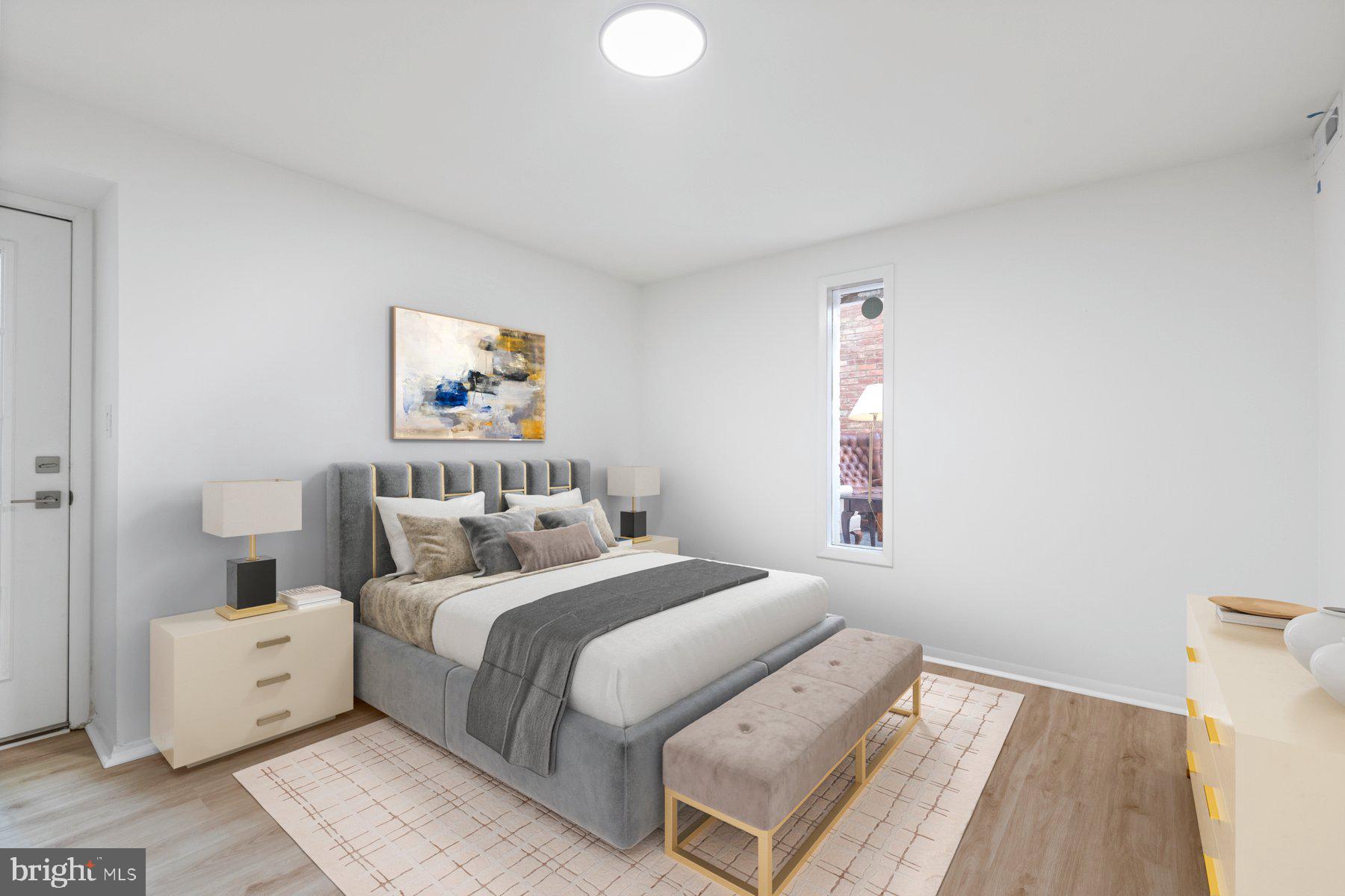 207 South Patrick Street, Unit 104 Alexandria, VA 22314 - Photo 10 of 33 a bedroom with a bed and a window