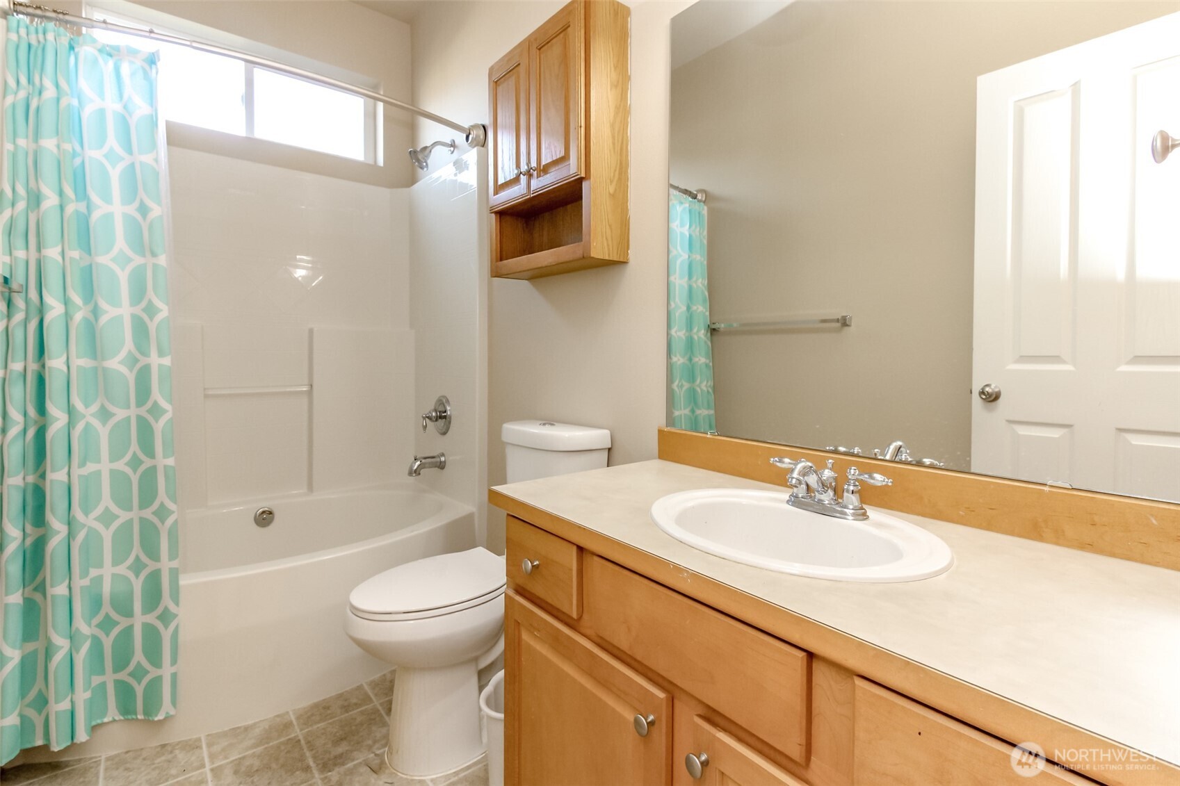 1113 O'Farrell Lane Northwest Orting, WA 98360 - Photo 20 of 36 a bathroom with a sink toilet and shower