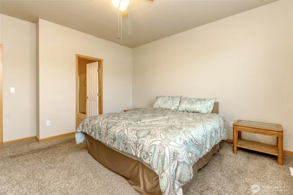 a bedroom with a bed and a dresser
